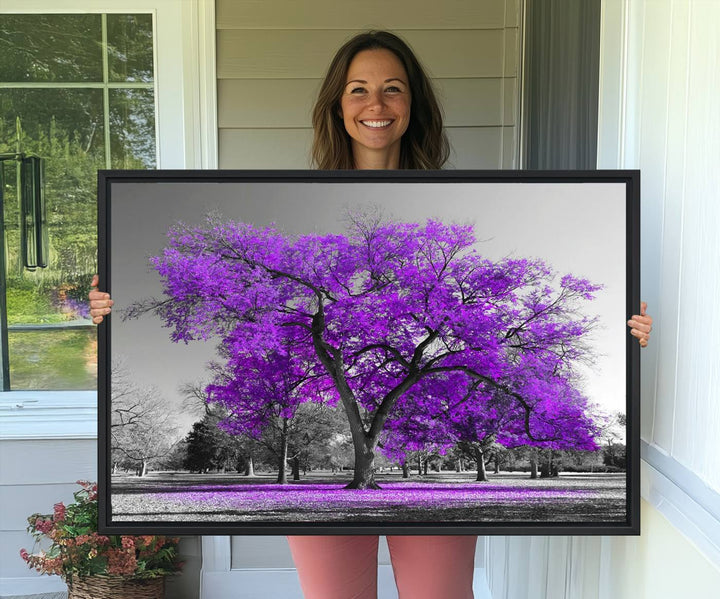 The Big Purple Tree Wall Art Canvas Print showcases a vibrant purple tree set against a black-and-white landscape.