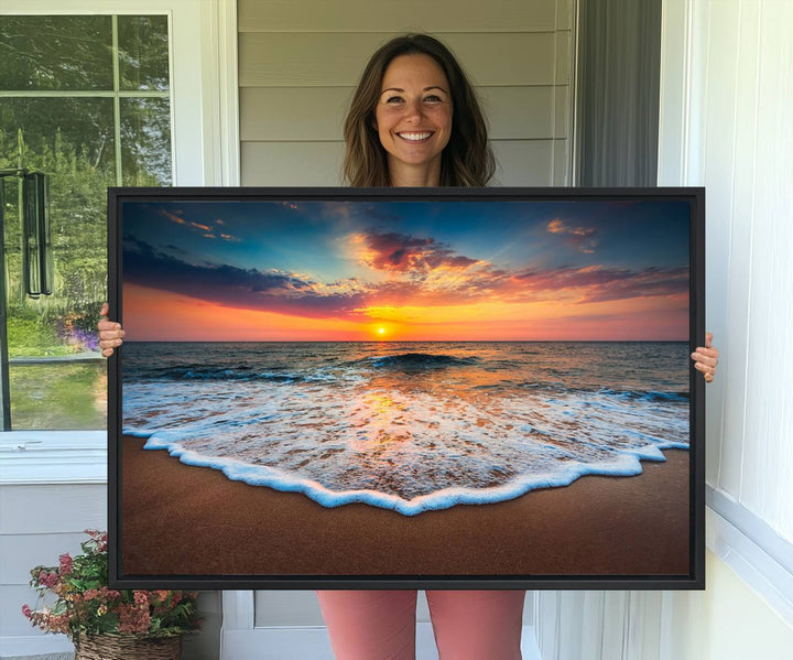 A Sunset with Calm Waves on the Beach Wall Art Canvas Print adorns the dining room.