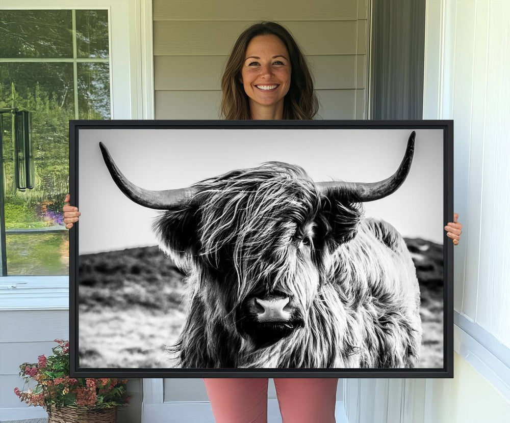 A Black and White Scottish Cow Canvas Print adorns the kitchen wall, perfect for farmhouse decor.