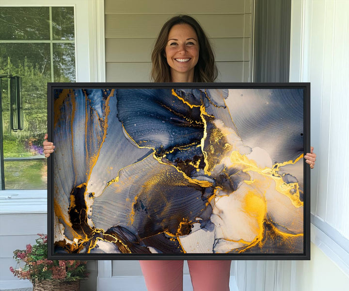 A modern luxury kitchen features a large gold and blue abstract canvas wall art print.