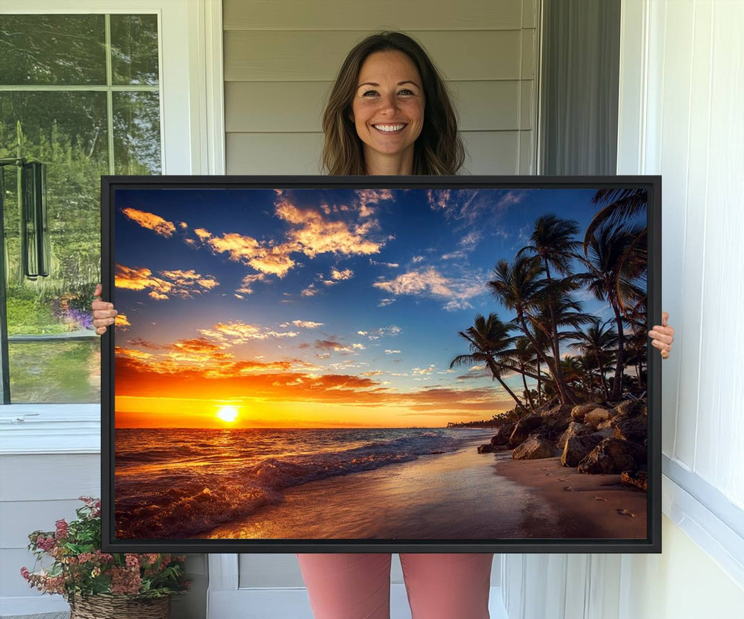 A stunning Tropical Beach Sunset Canvas Art featuring palm trees and ocean waves, created as a Giclee print.