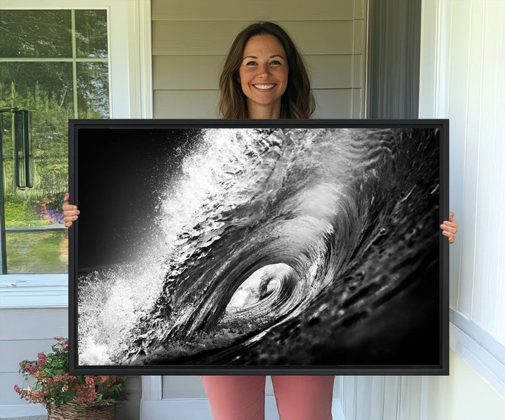 The Black Ocean Wave at Sunset Canvas Art hangs on a grey wooden wall.