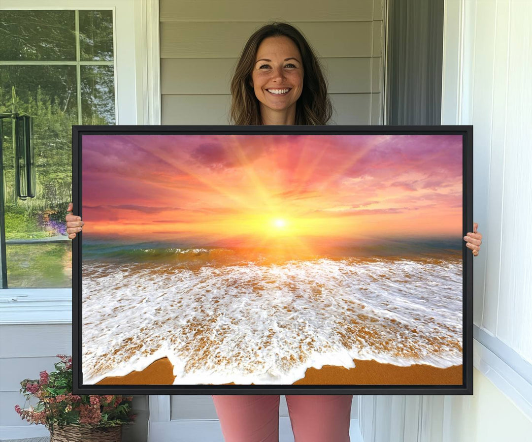 Golden Beach Sunrise 3-panel canvas art of ocean waves, hung on a wooden wall.