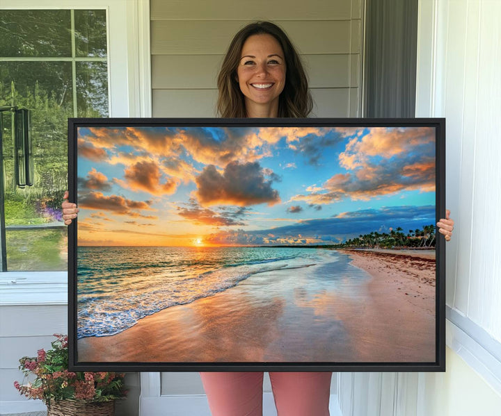 A wall displays Sunset Ocean Waves on Tropical Beach 3-panel canvas art.