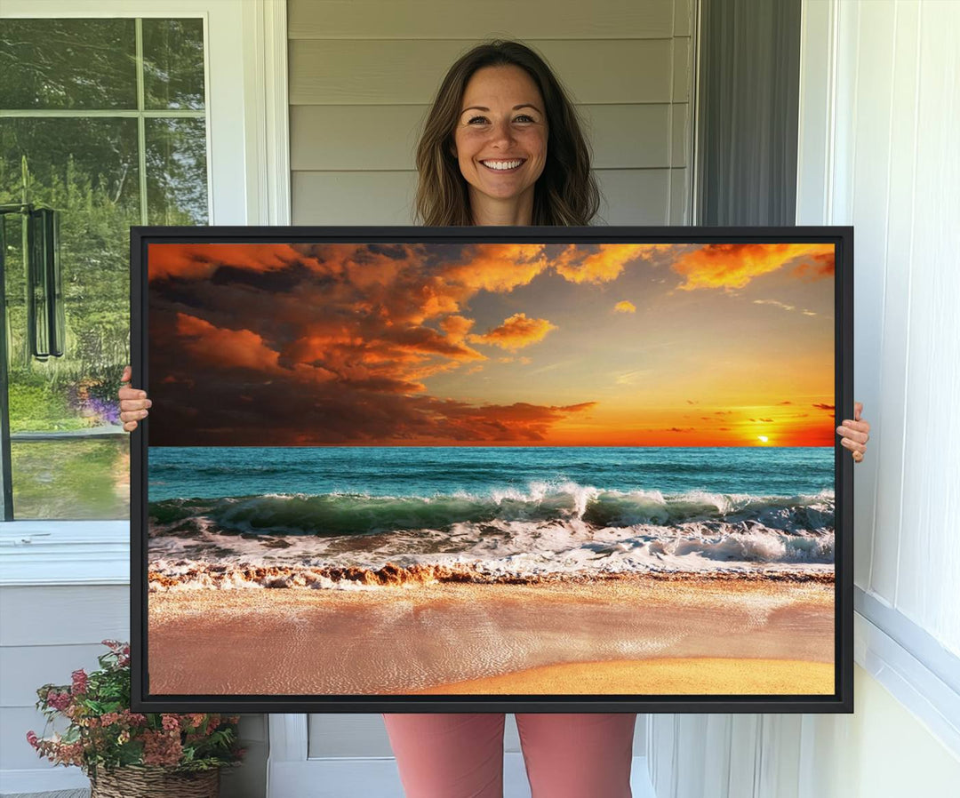 A Golden Sunset Beach triptych seascape canvas hangs on the wall.