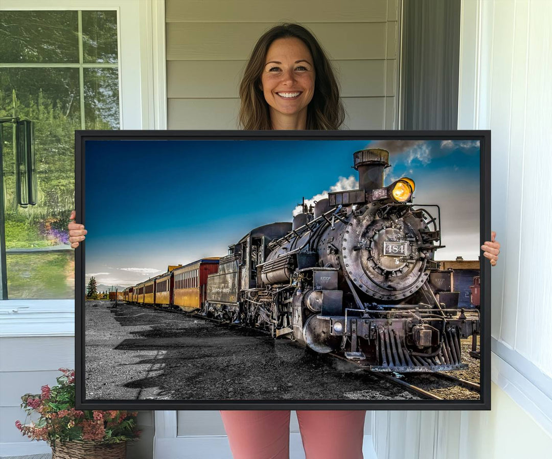 The Train Wall Art Canvas Print features a vintage steam train with a bright headlight.