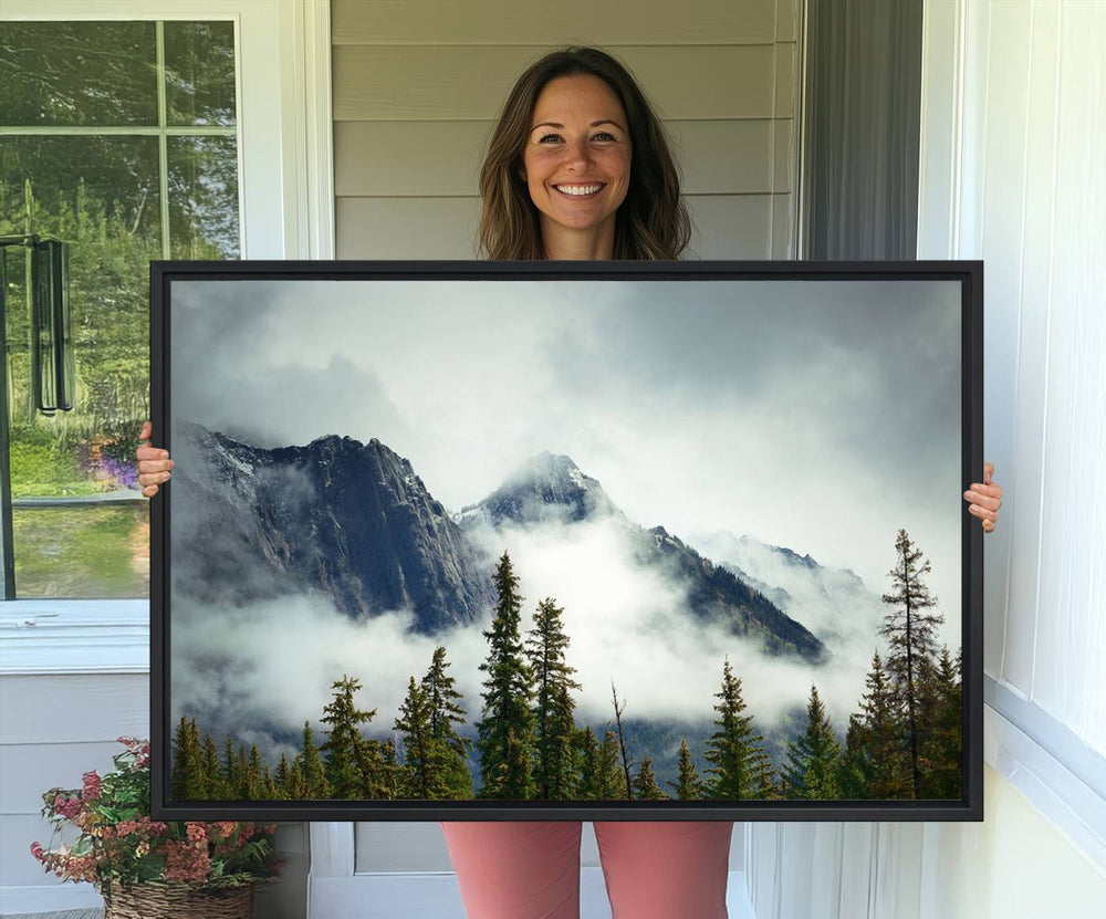 The Mountain Mist Canvas Wall Art beautifully showcases natures beauty with a depiction of a foggy forest and mountain.