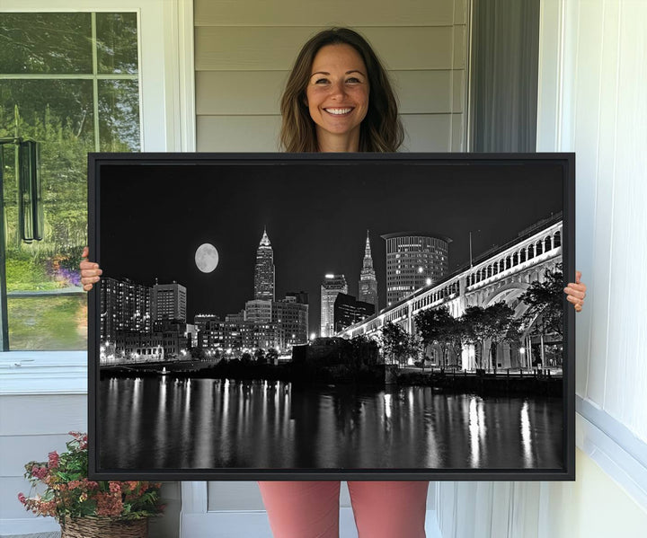 Cleveland Night Skyline Canvas Print: A museum-quality piece, ready to hang, featuring a stunning full moon and its reflections below.