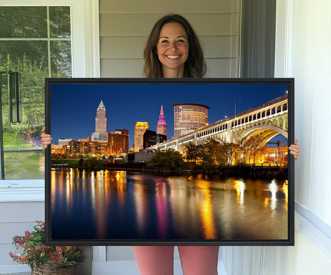 Cleveland Night Skyline Canvas: Cityscape with an illuminated bridge reflecting on calm water.