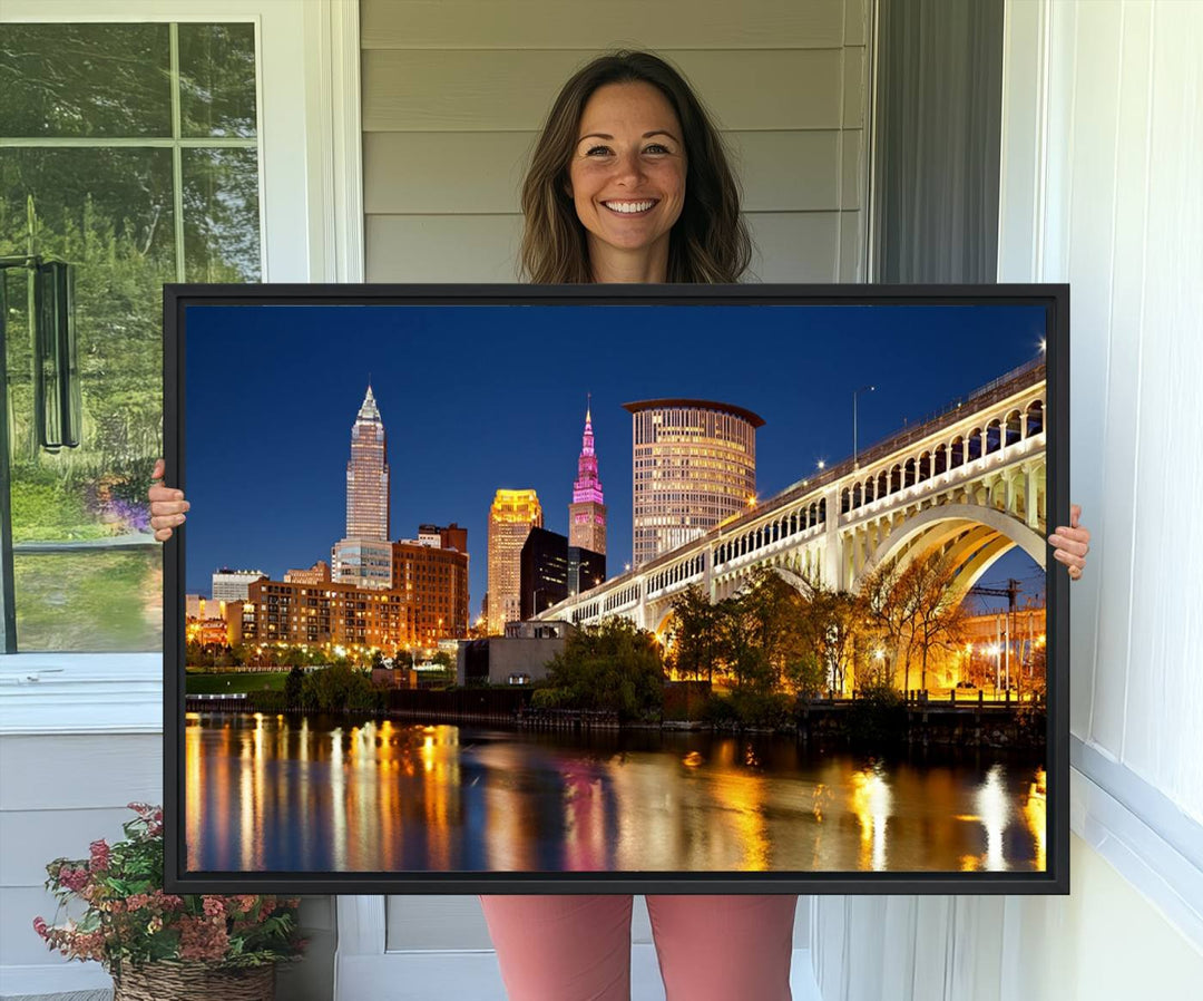 The Cleveland City Lights Canvas showcases a lit-up bridge and cityscape at night.