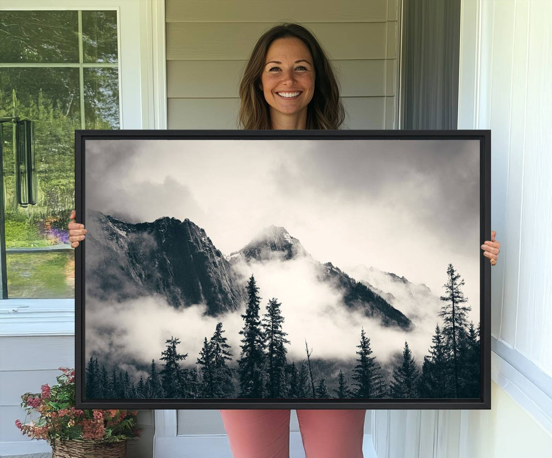 A large foggy mountain forest canvas print hangs prominently in the room.