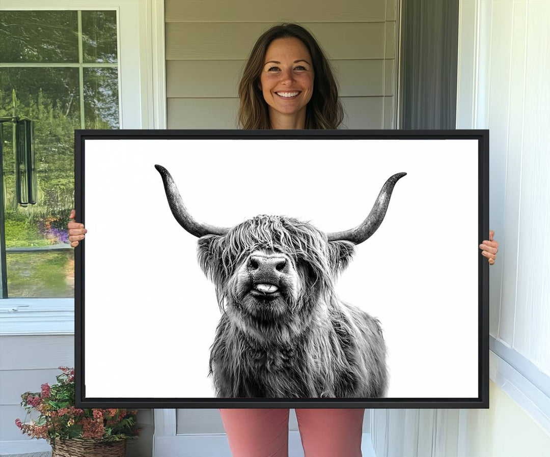 The Fanny Highland Cow art print decorates the modern kitchen, featured in black and white.