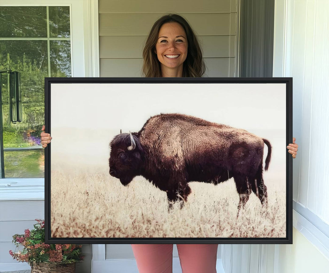 The dining room showcases the Bison in Field canvas print.