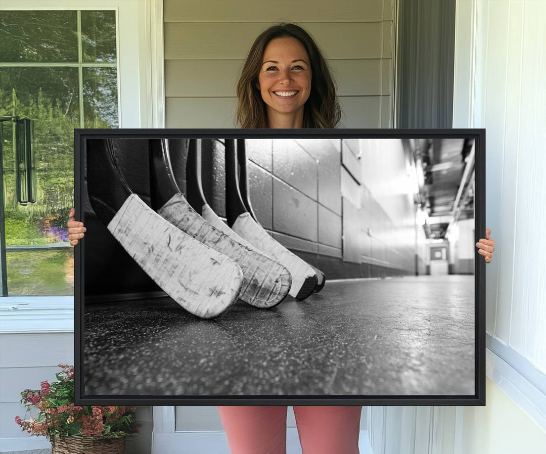 Ice Hockey Wall Art Canvas Print features a UV-protected black and white photo of hockey sticks.