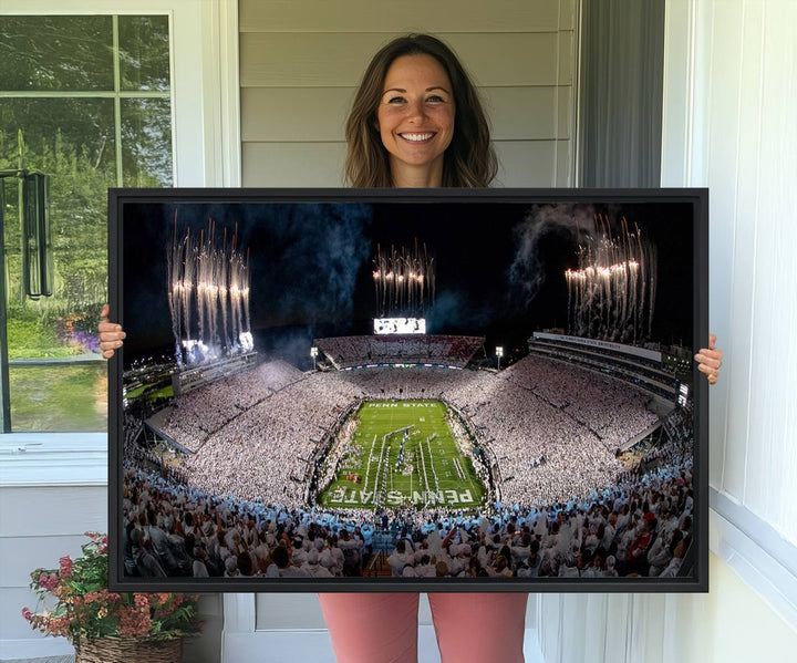 The perfect Penn State Football canvas wall art features a depiction of Beaver Stadium filled with fans in white, with fireworks exploding above.