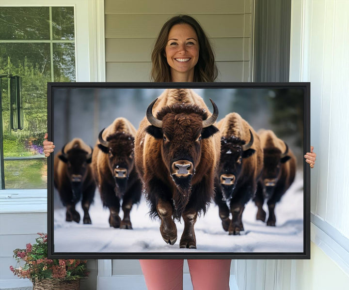 The dining room features an American Bison Herd Canvas Print against the snow.