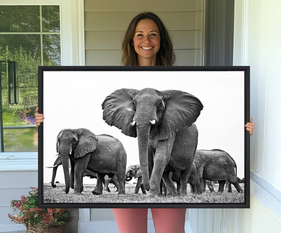 A modern dining area features a Black White Elephant Family Wall Art Canvas Print.