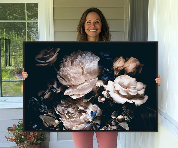 A large canvas art print of pink peonies flowers adds a vibrant touch to the space.