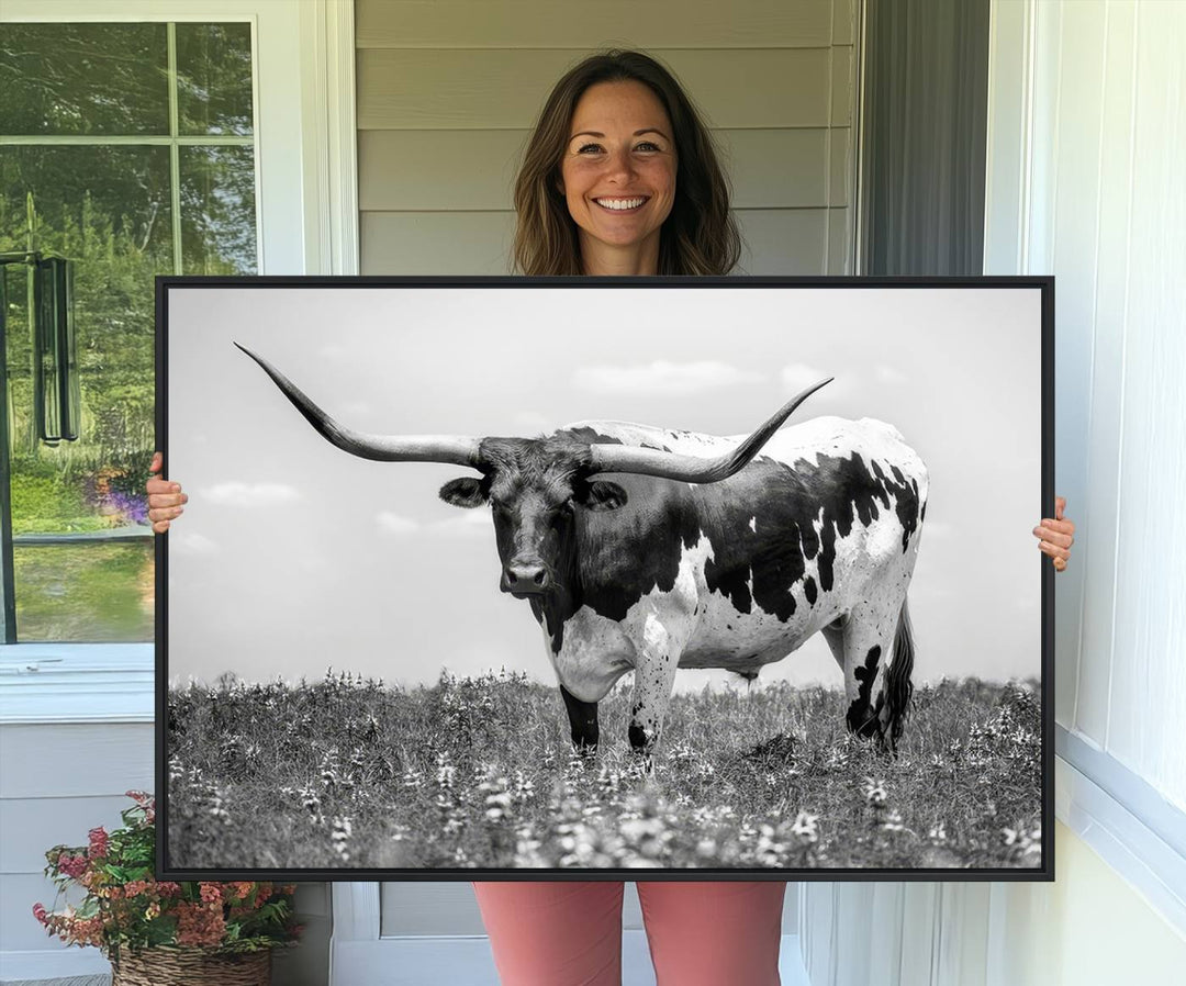 Texas Black White Highland Longhorn Cow Wall Art Canvas displayed on the wall.