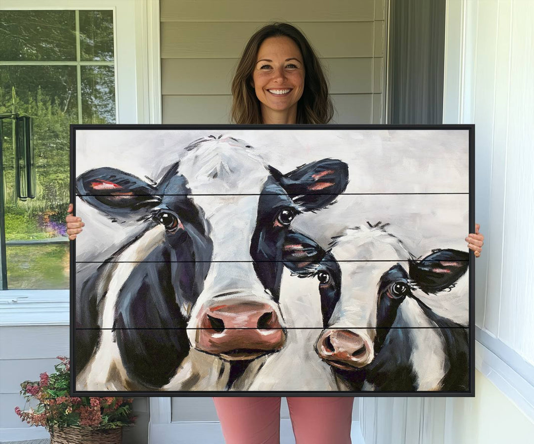 The Vintage Baby and Mom Cattle Canvas, featuring cows with black and white patches, is a prominent piece of wall art.