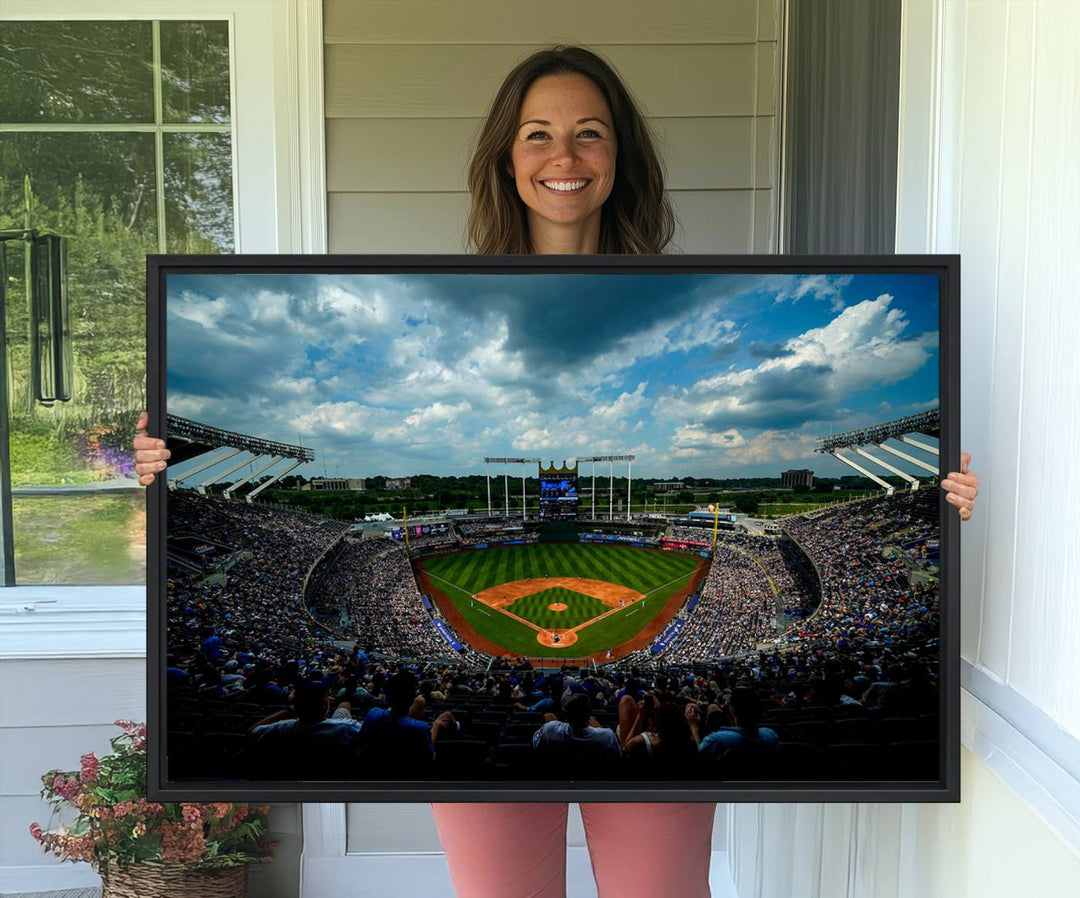 A 3-panel print of Kauffman Stadium, showcasing a crowded baseball field under cloudy skies.