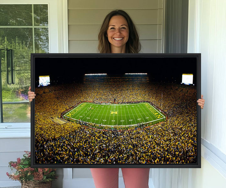 Aerial view of Michigan Stadium night game, ideal for Michigan Wolverines Football Team displayed on a triple canvas wall art.