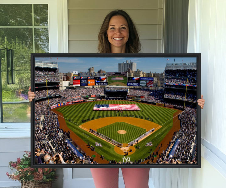 The Yankee Stadium New York wall art print features a vibrant scene of baseball fans with a large flag and players, expertly capturing the spirit of the game. This ready-to-hang décor is perfect for adding a dynamic touch to any space.