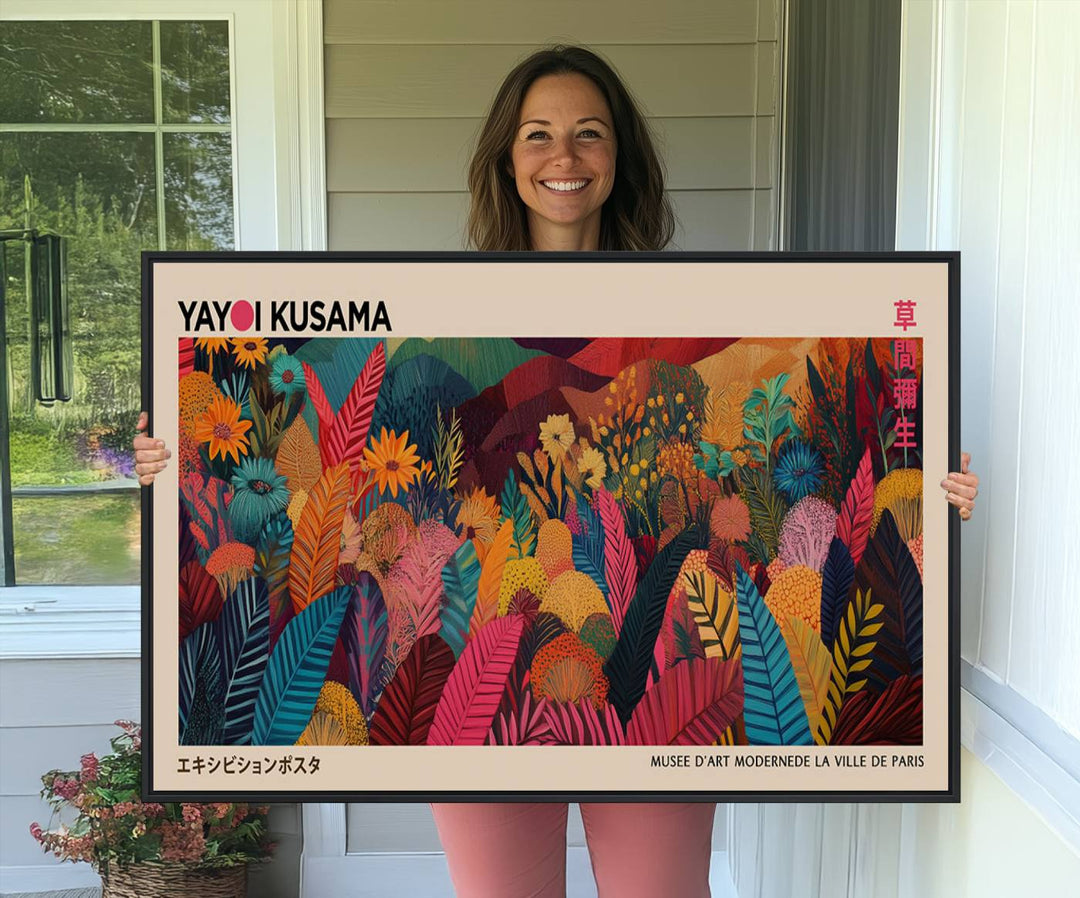 A Yayoi Kusama Wall Art Canvas Print is framed by a window and potted plant.