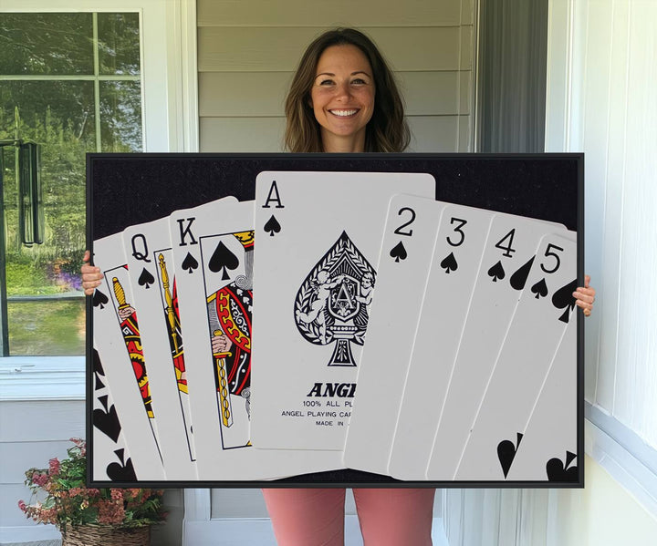 The oversized Poker Wall Art features the Ace of Spades and is displayed on a porch.