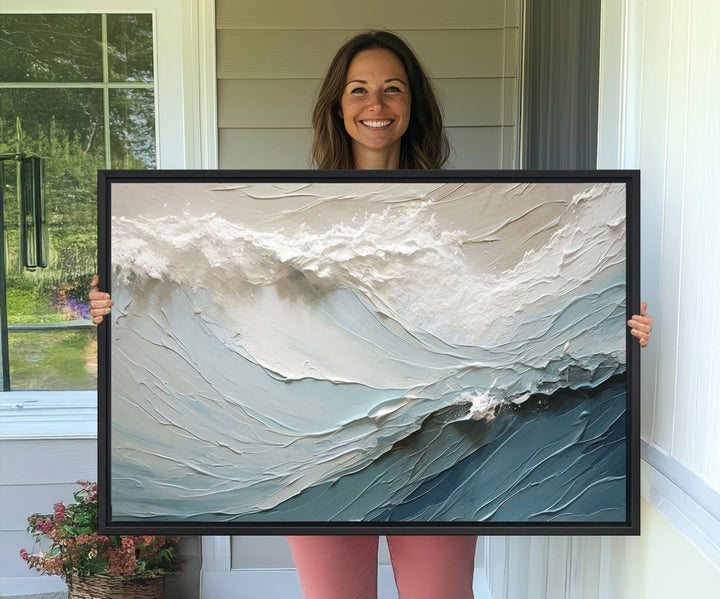 The Waves Abstract Wall Art Print is a large textured painting featuring ocean waves in beige and blue tones. This modern framed abstract canvas print captures the serene essence of seaside tranquility and serves as stunning ready-to-hang wall art, making it perfect as living room decor.