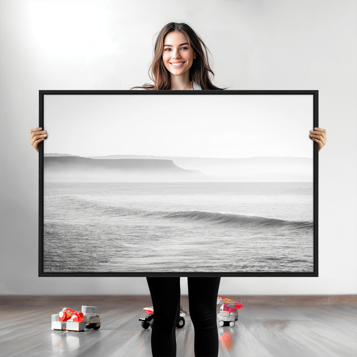 A black and white minimalist seascape featuring soft rolling waves and misty distant cliffs, creating a serene and timeless coastal atmosphere.