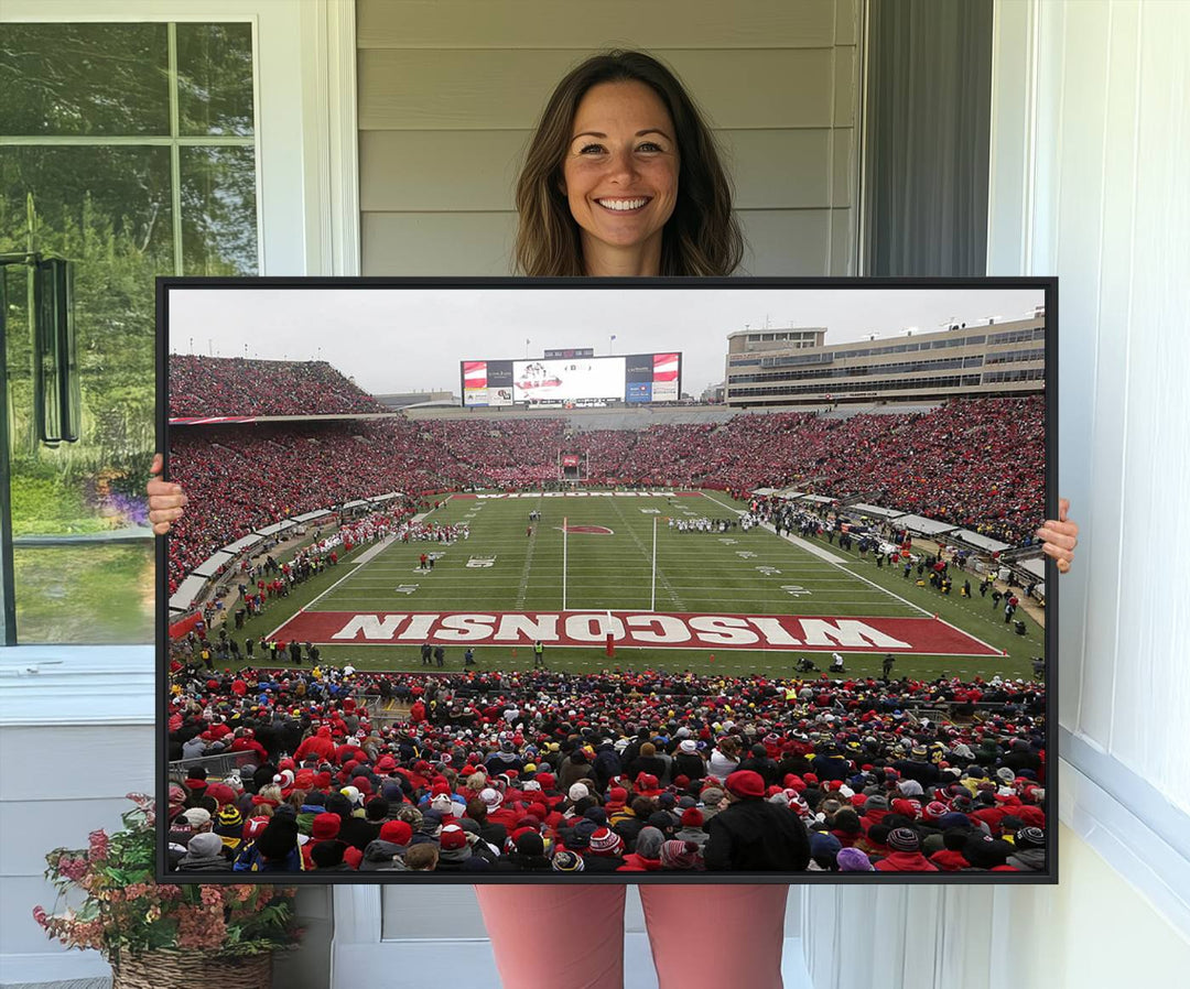 The wall art depicts WISCONSIN in red and white, similar to Wisconsin Badgers Football Canvas Art.