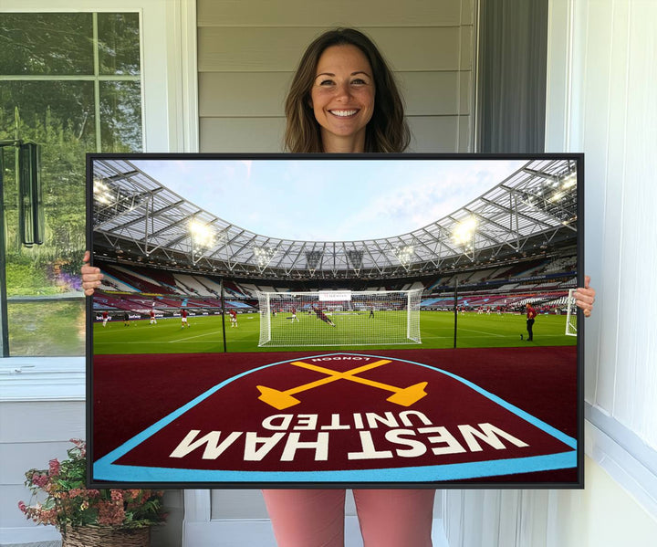 A soccer stadium with the West Ham United FC logo.