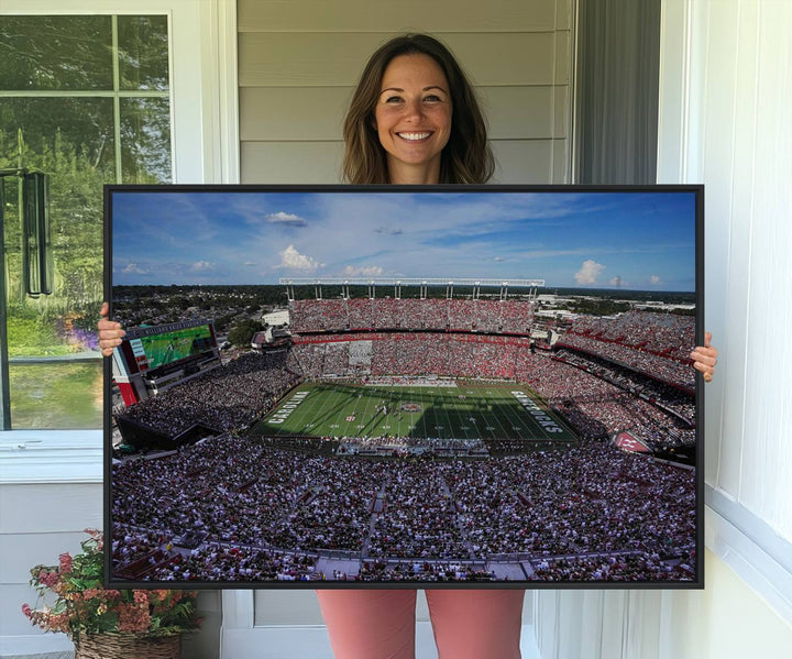 The wall art is a South Carolina Gamecocks print, showcasing Williams-Brice Stadium from a distance under clear skies.