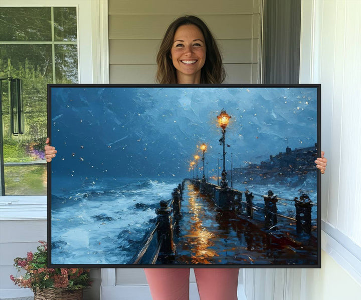 A framed oil painting depicts a stormy night at a beach pier, with glowing lamps and waves beneath a snow-filled sky.