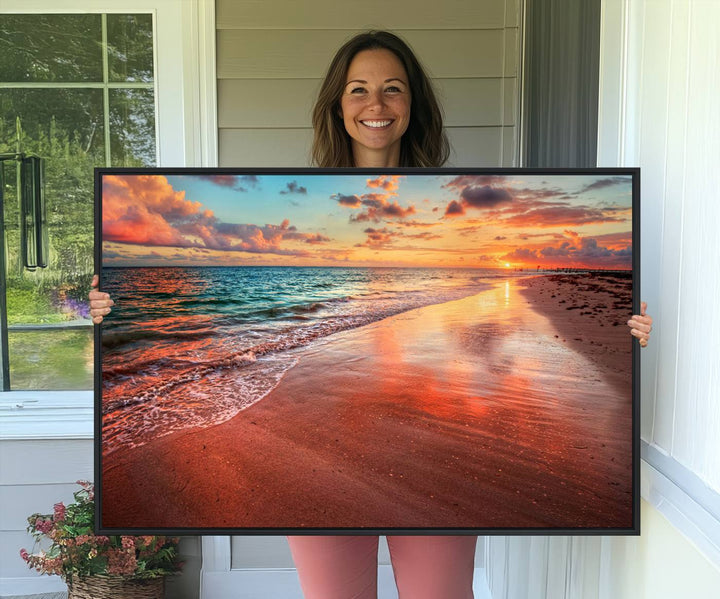 An Ocean Canvas Print depicts a sunset over a beach with reflections.