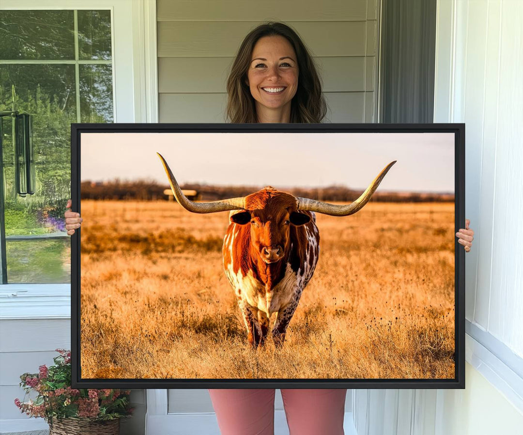 The Longhorn Cow Wall Art framed canvas brings rustic charm and farmhouse decor with its warm field scene.