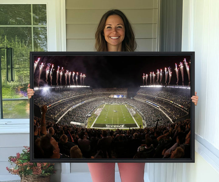 The wall art of Eagles Field Stadium showcases nighttime fireworks over a full stadium.