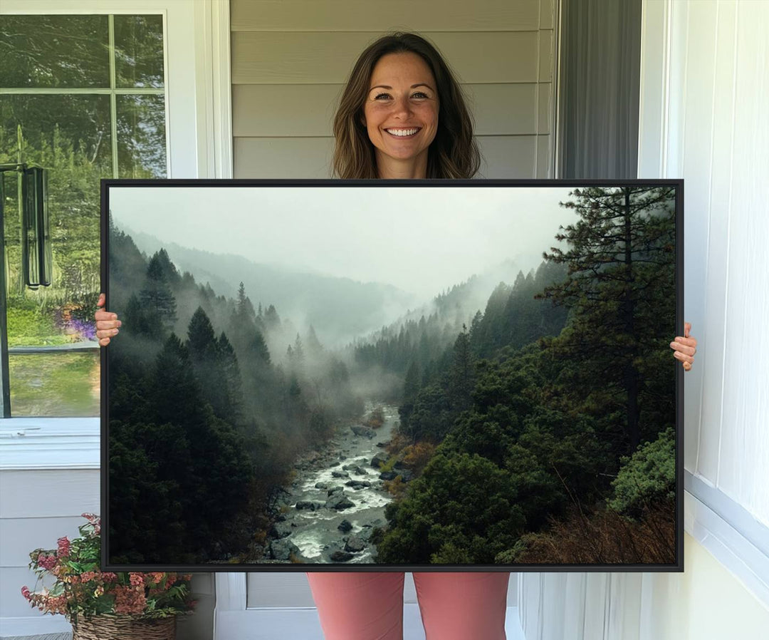 The Misty Forest Wall Art features a serene landscape with a misty river and evergreens, ideal for enhancing the ambiance of any living room or cabin.