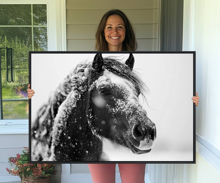 A large 3-panel rustic farmhouse wall art showcases a black and white winter horse canvas print against a snowy backdrop.