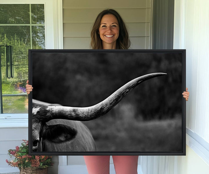 Cow Longhorn Wall Art: This black and white print adds rustic charm.