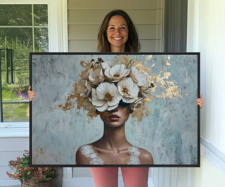 Golden Petal Wall Art: A womans face adorned with a gold floral design on a teal background, presented in a 3-panel modern glam canvas.