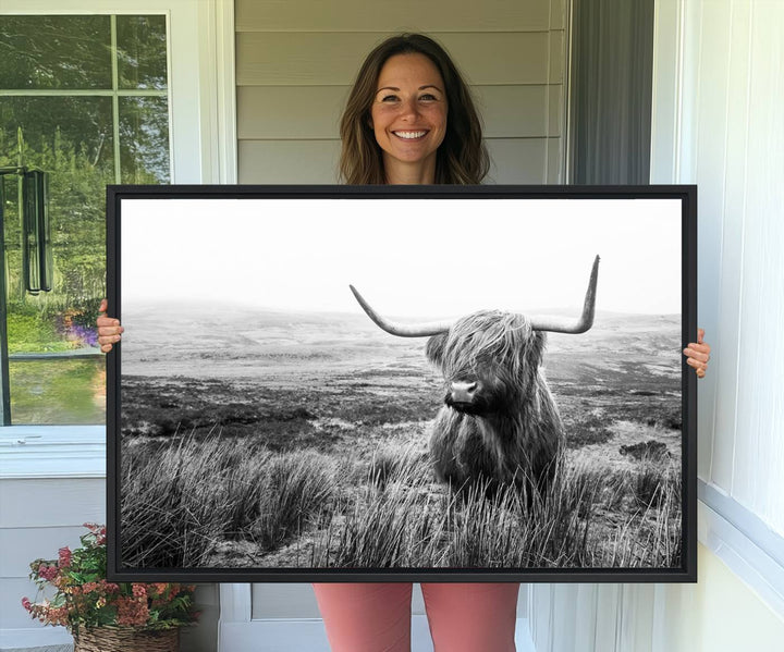 The Scottish Highland Cow black and white canvas print adds rustic farmhouse charm to any wall.