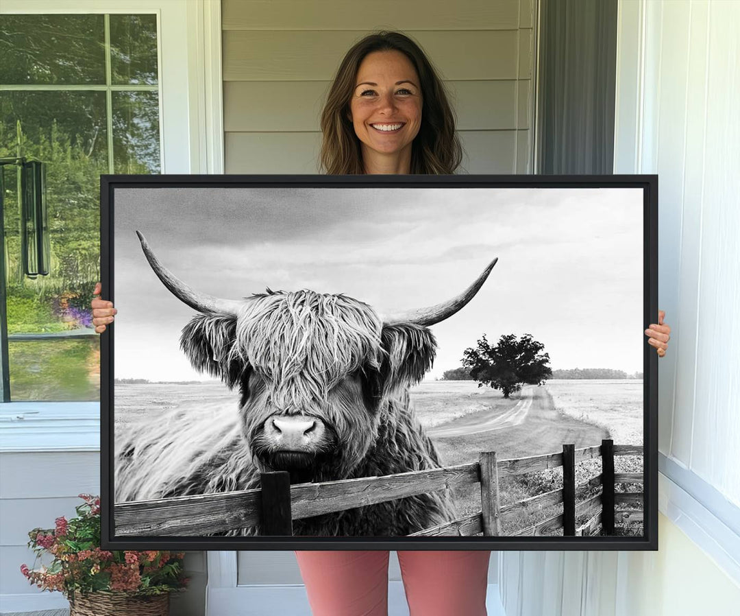 The Scottish Highland Cow Wall Art, a black and white canvas print, enhances rustic farmhouse décor.