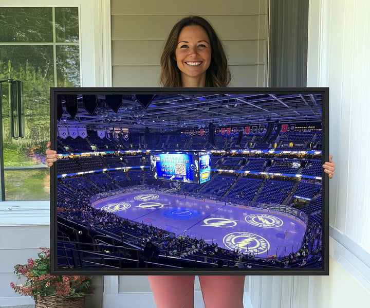 The wall art canvas print at Amalie Arena features team logos on ice, encapsulating the vibrant atmosphere of an NHL hockey stadium.