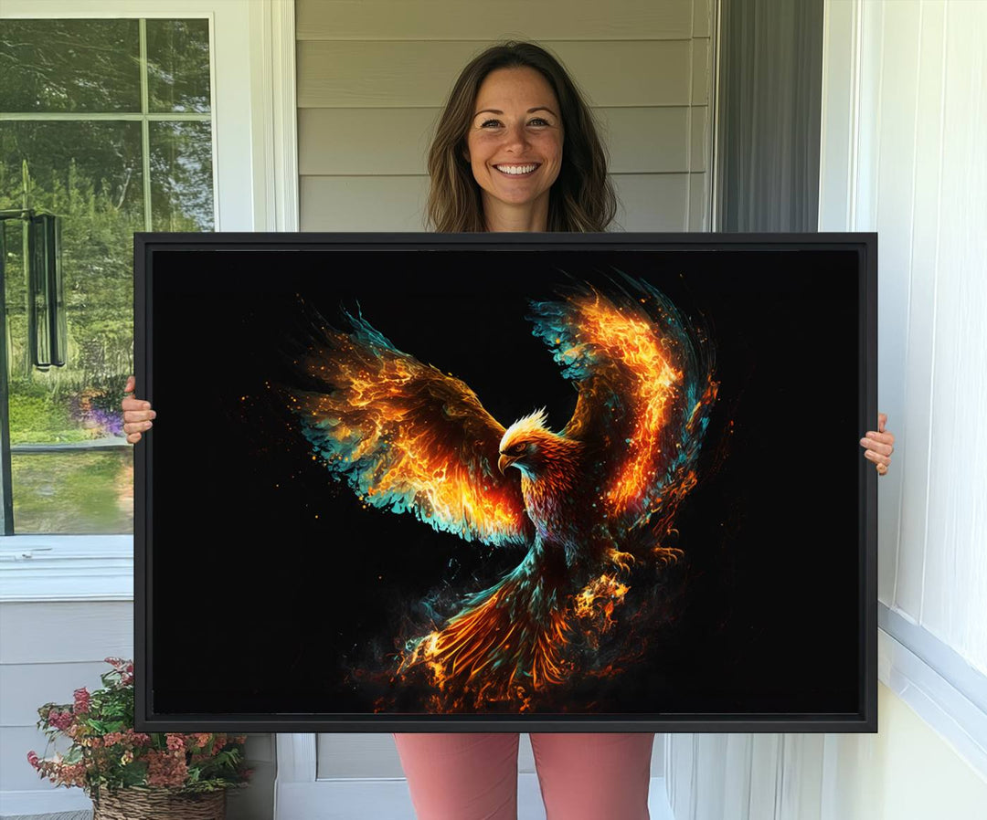 The Fiery Phoenix Canvas Print, showcasing a majestic bird with fiery wings against a black background, makes for the perfect bold decor in your living room.