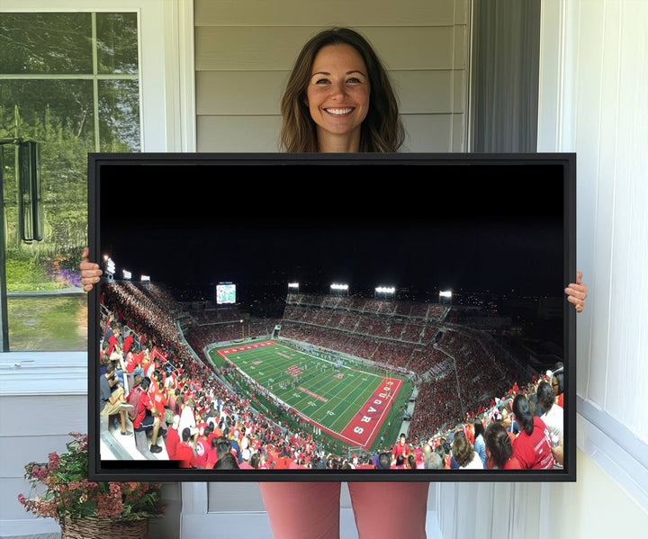 The wall art canvas print features a scene from a packed TDECU Stadium at night, highlighting the field and scoreboard.