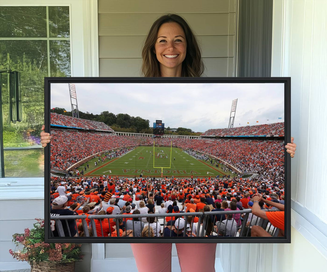 The Virginia Cavaliers Wall Art Canvas Print features a thrilling game at Scott Stadium surrounded by greenery.