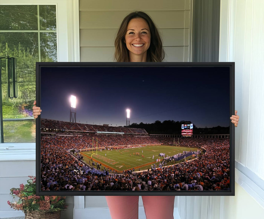 A nighttime game at Scott Stadium, floodlit—a scene from the Virginia Cavaliers Football art print.