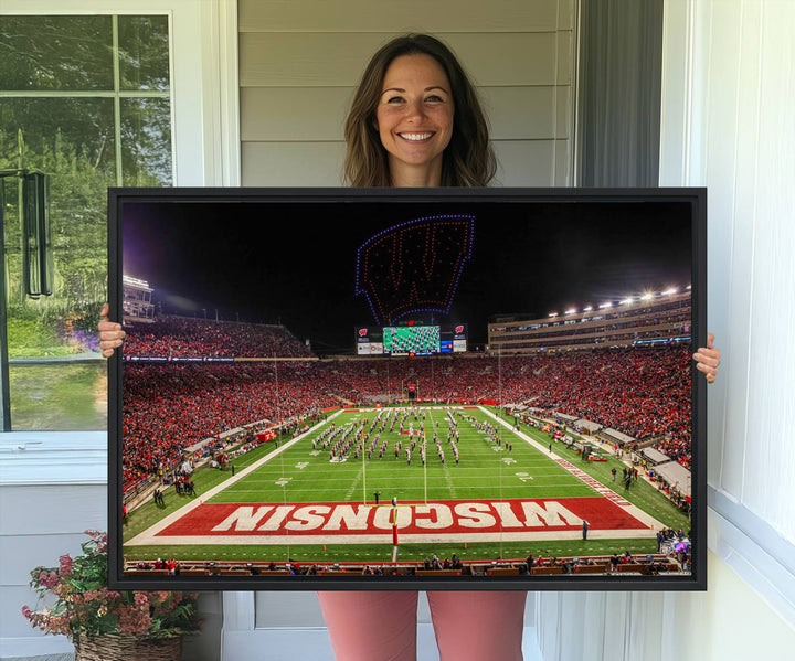 A premium canvas print captures a vibrant scene of Camp Randall Stadium featuring a lively football game with cheering fans and the energetic movements of the band.